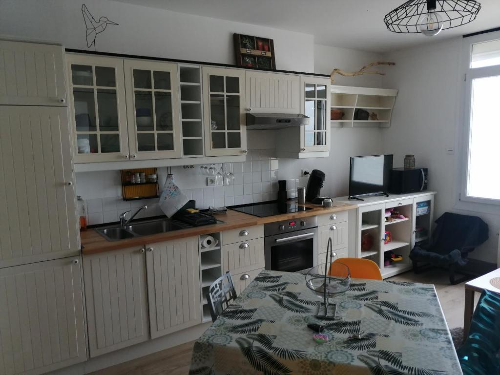 Kuchyň nebo kuchyňský kout v ubytování Appartement Cosy