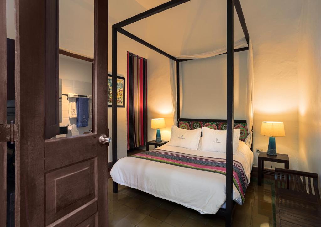 Postel nebo postele na pokoji v ubytování Hotel Villa Colonial