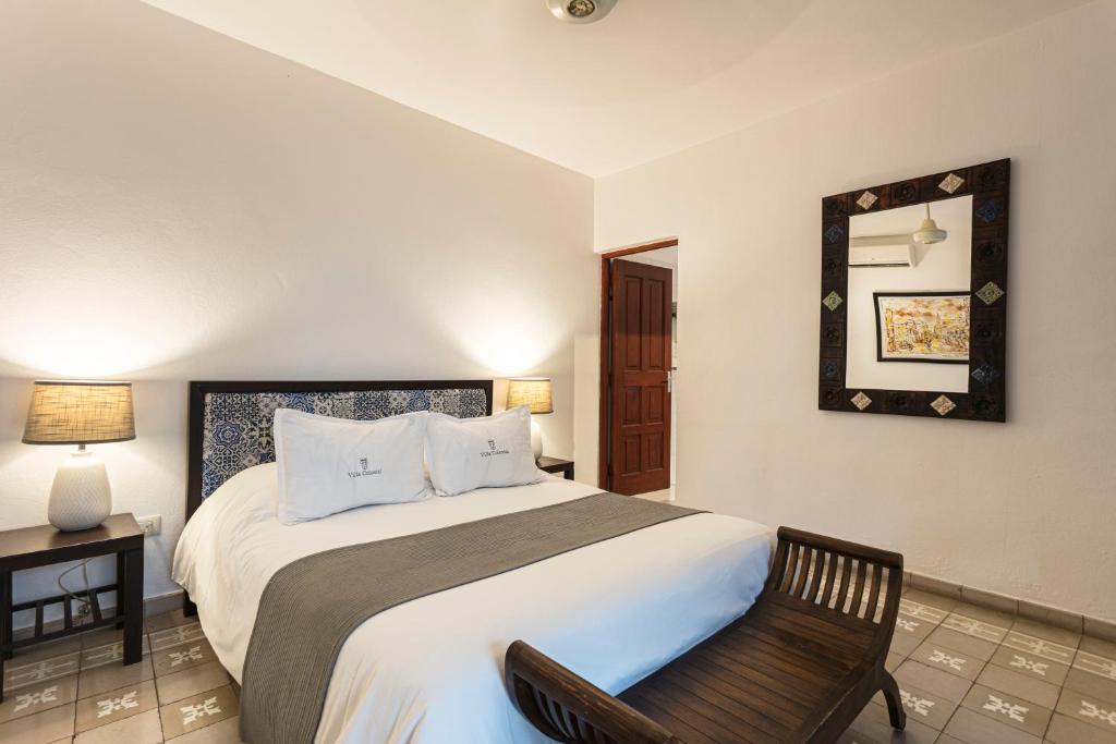 Postel nebo postele na pokoji v ubytování Hotel Villa Colonial
