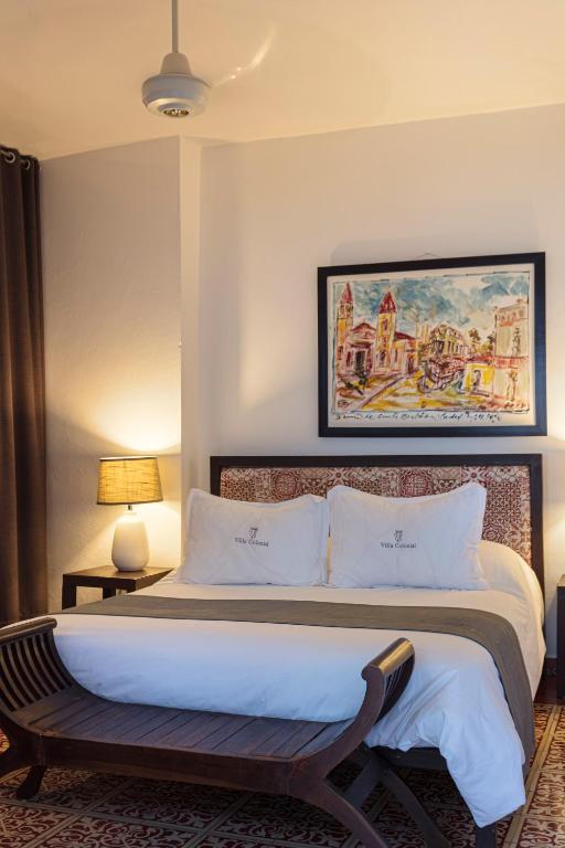 Postel nebo postele na pokoji v ubytování Hotel Villa Colonial