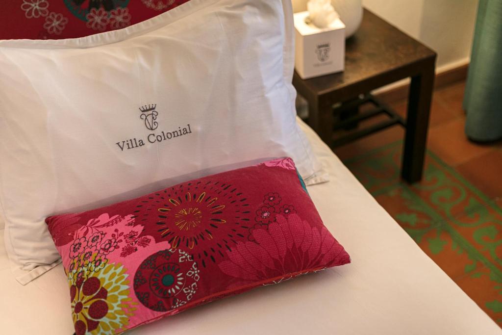 Postel nebo postele na pokoji v ubytování Hotel Villa Colonial