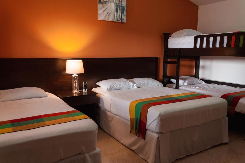 Cama o camas de una habitación en Hotel Boutique Victoria