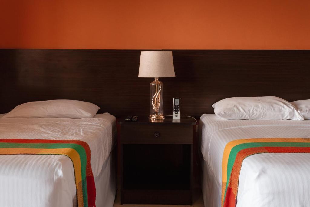 Cama o camas de una habitación en Hotel Boutique Victoria