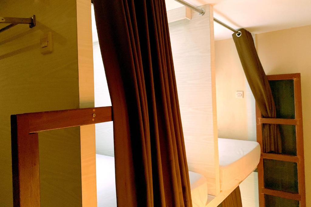 Postel nebo postele na pokoji v ubytování Omah Pelem Syariah
