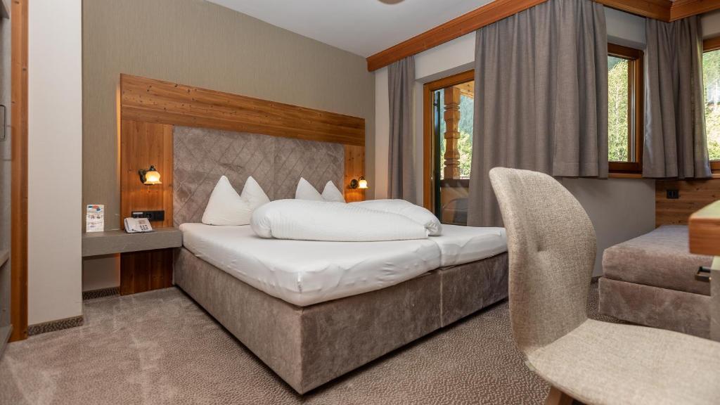 Postel nebo postele na pokoji v ubytování Apparthotel Thalerhof