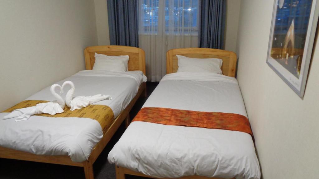 Postel nebo postele na pokoji v ubytování Ueno Frex Hotel
