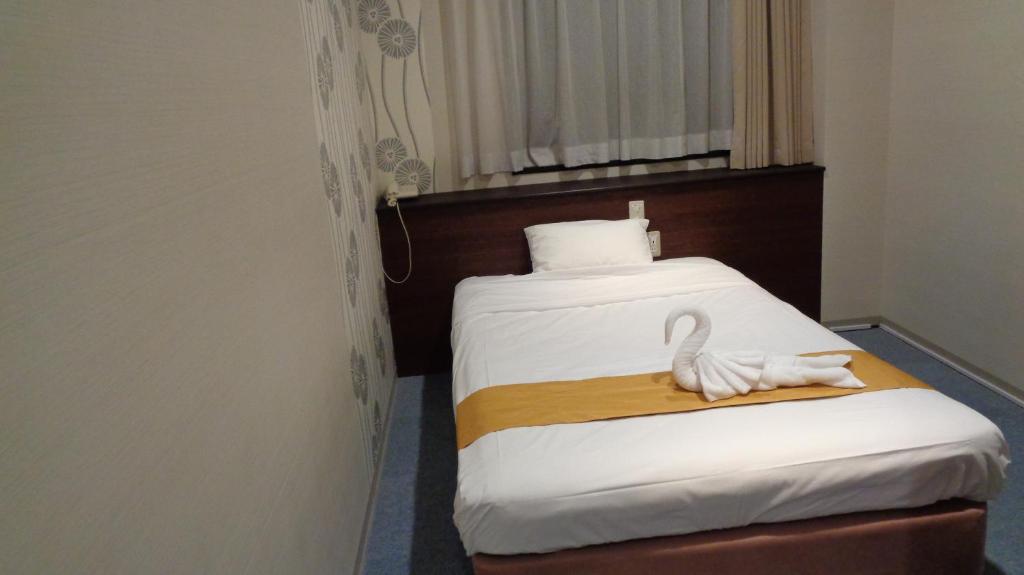 Postel nebo postele na pokoji v ubytování Ueno Frex Hotel