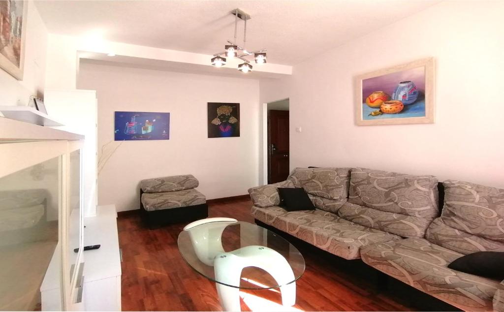 a living room with a couch and a table at Hotel Molinos in Granada