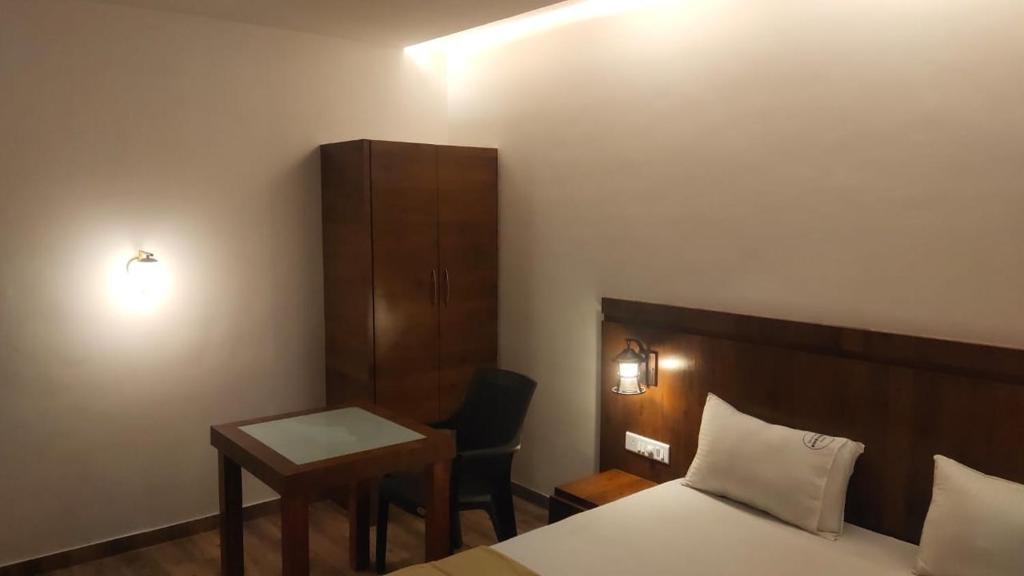 En eller flere senger på et rom på Hotel Anvisha Executive