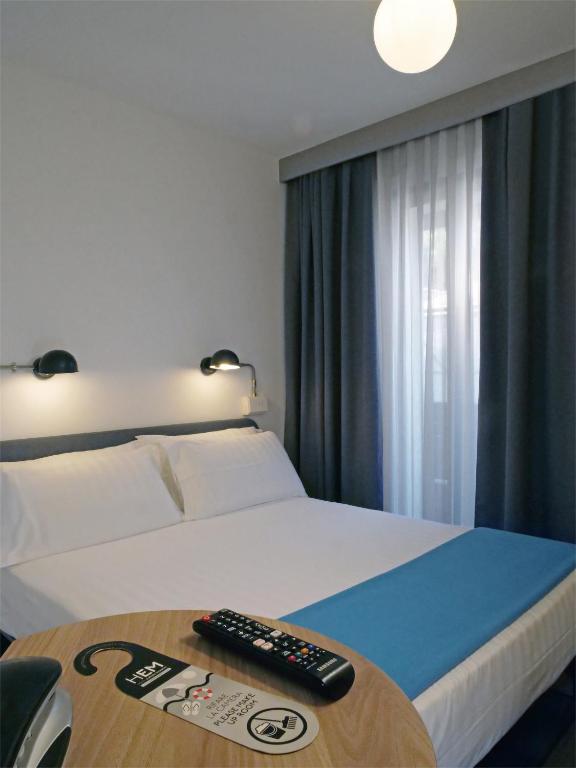 Postel nebo postele na pokoji v ubytování Hotel Europa Monetti