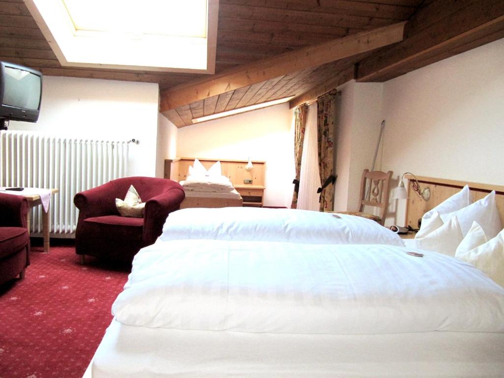 Postel nebo postele na pokoji v ubytování Gästehaus Menkenbauer