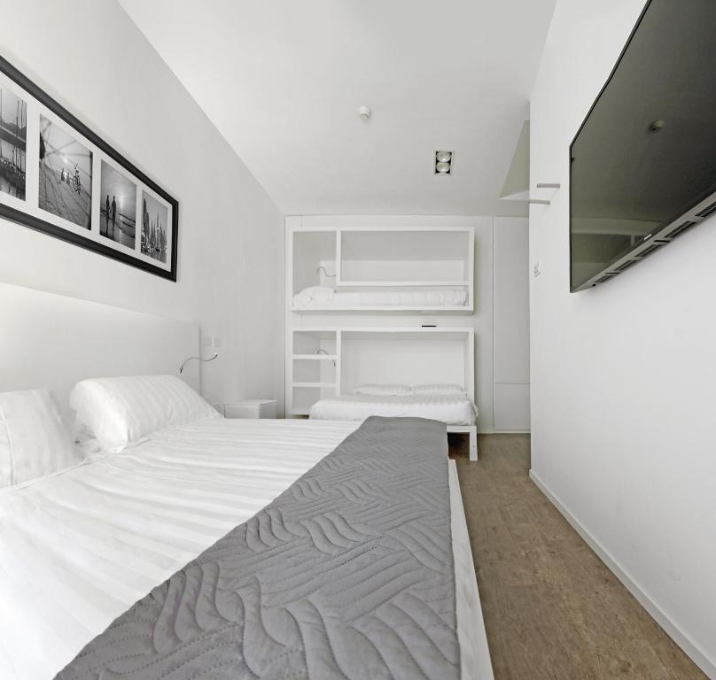 Postel nebo postele na pokoji v ubytování Hotel Europa Monetti