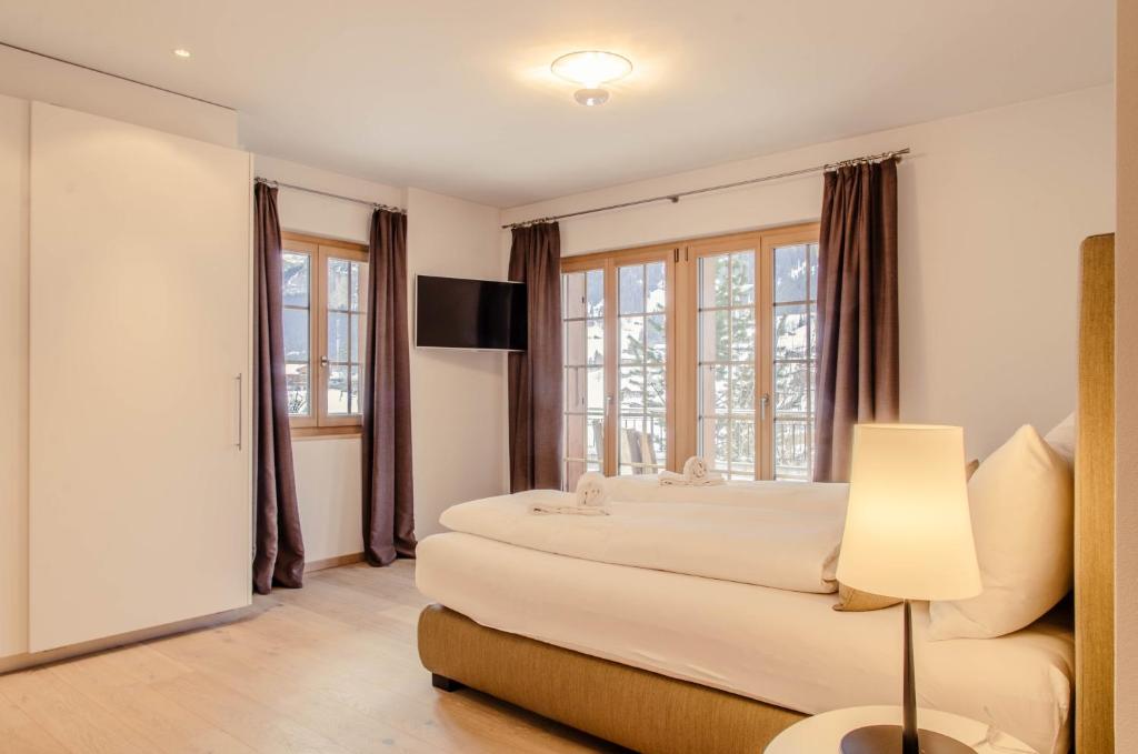 Postel nebo postele na pokoji v ubytování Chalet La Gioventu - GRIWA RENT AG