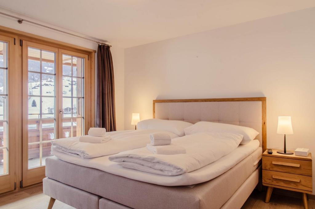 Postel nebo postele na pokoji v ubytování Chalet La Gioventu - GRIWA RENT AG