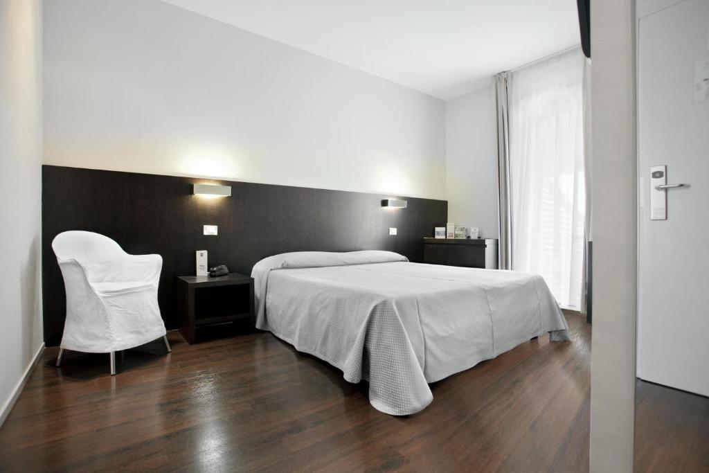 Postel nebo postele na pokoji v ubytování Hotel Europa Monetti
