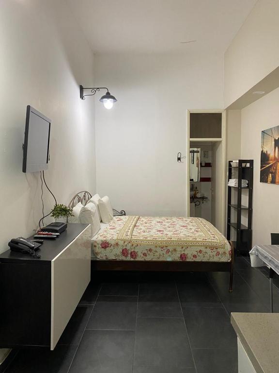 Postel nebo postele na pokoji v ubytování Hotel Rehovot