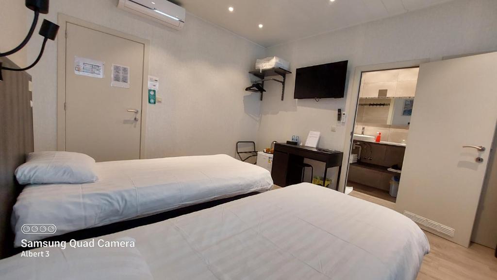 Postel nebo postele na pokoji v ubytování Albert - Rooms