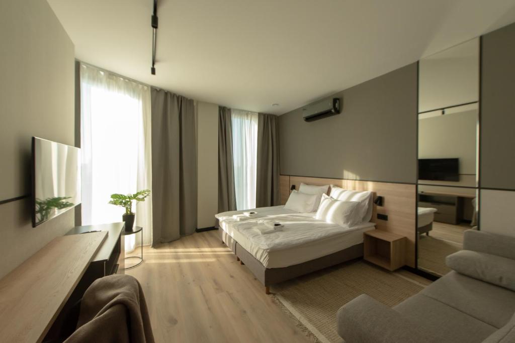 Posteľ alebo postele v izbe v ubytovaní Sarnia Point Apartamenty Prestige