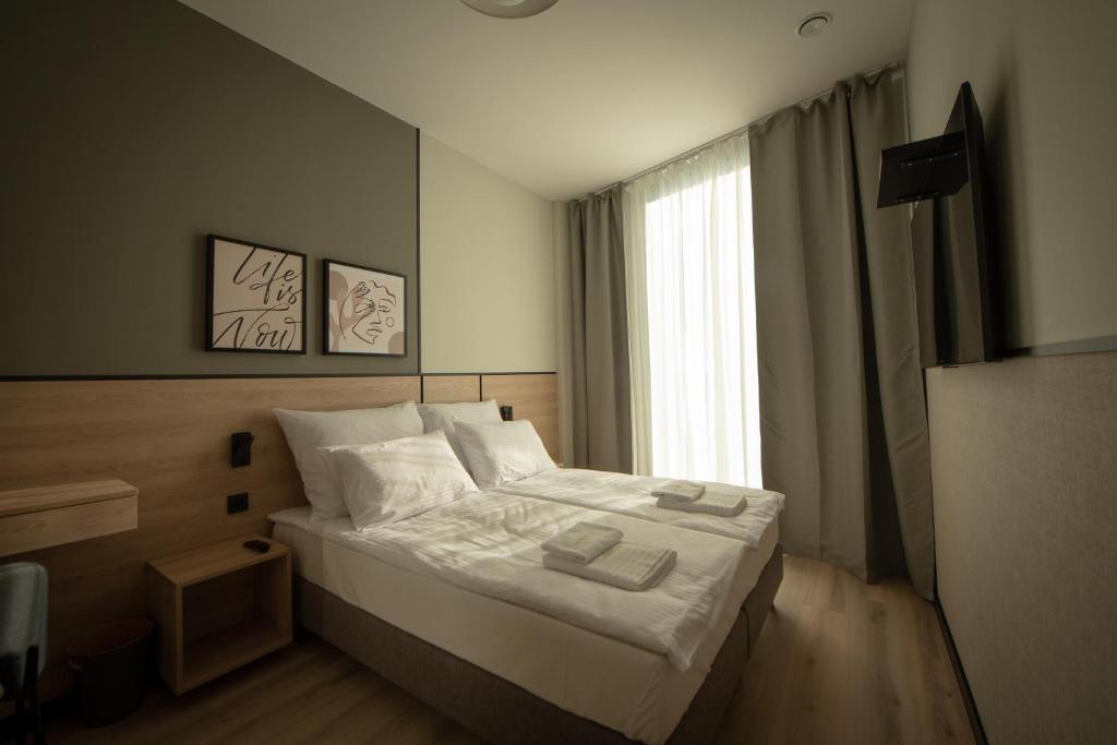 Posteľ alebo postele v izbe v ubytovaní Sarnia Point Apartamenty Prestige