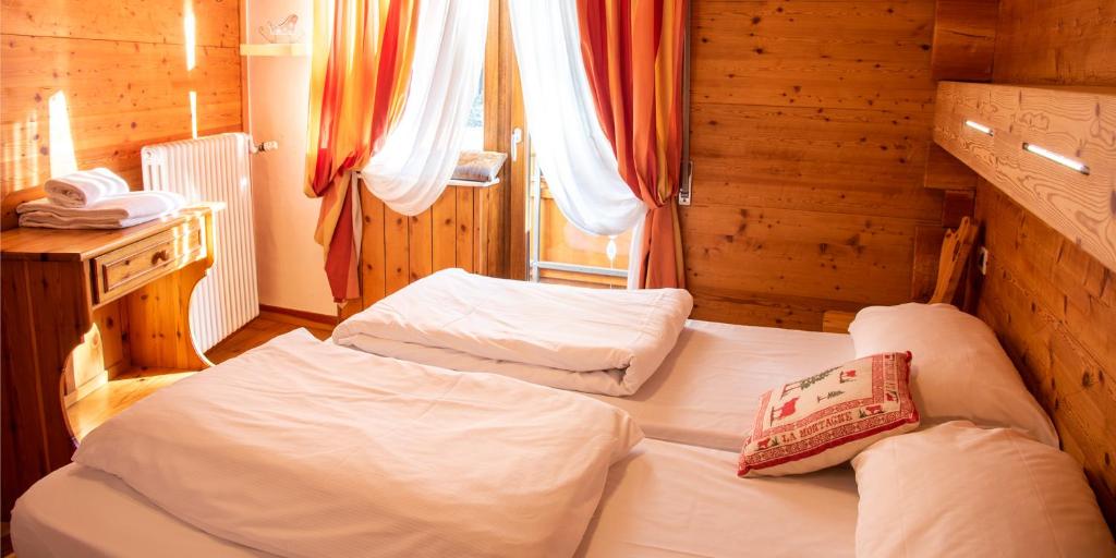 Postel nebo postele na pokoji v ubytování Hotel Capriolo