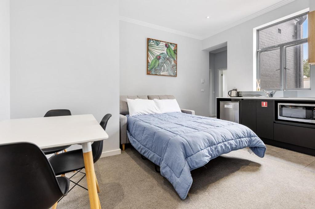 Postel nebo postele na pokoji v ubytování Civic Apartments