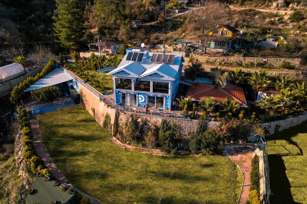 an aerial view of a house on a hill at Dolphin Boutique Hotel & Restaurant in Karacaören