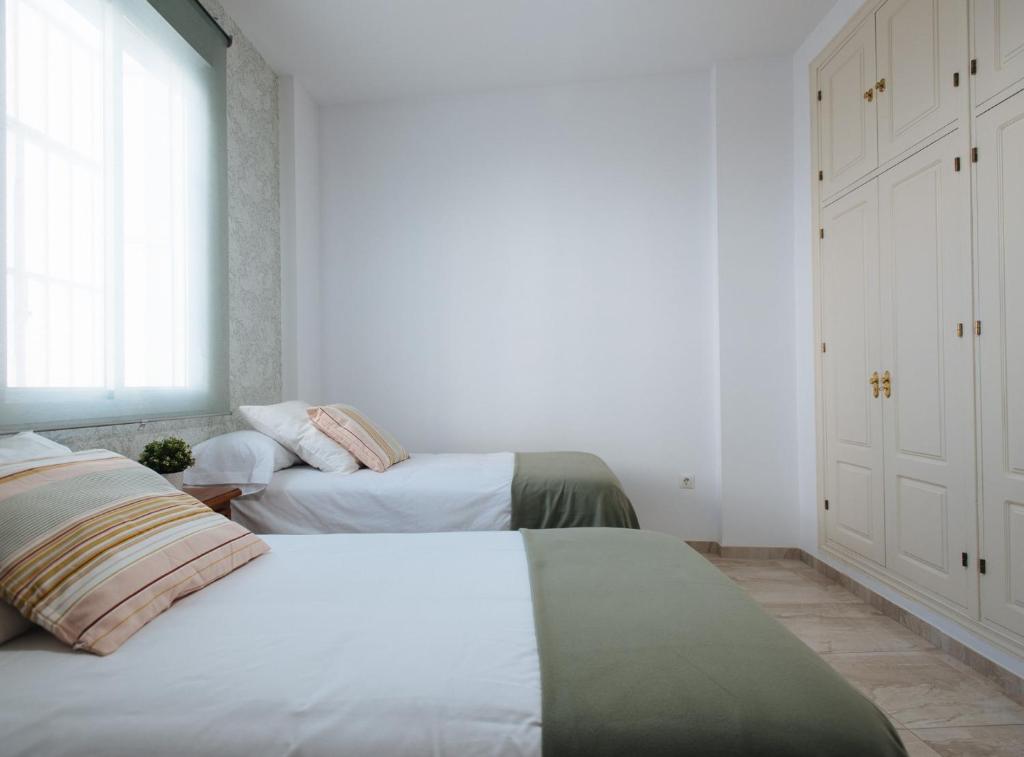 Postel nebo postele na pokoji v ubytování Siete Revueltas Suite Apartment