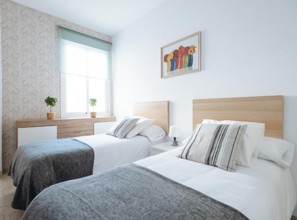 Postel nebo postele na pokoji v ubytování Siete Revueltas Suite Apartment