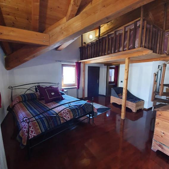 Postel nebo postele na pokoji v ubytování Agriturismo B&B Chèvres à Cheval