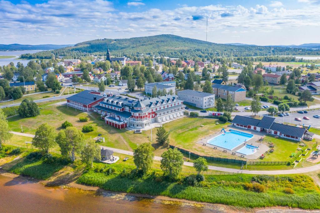 an aerial view of a large building next to a river at Grand Arctic Resort in Överkalix