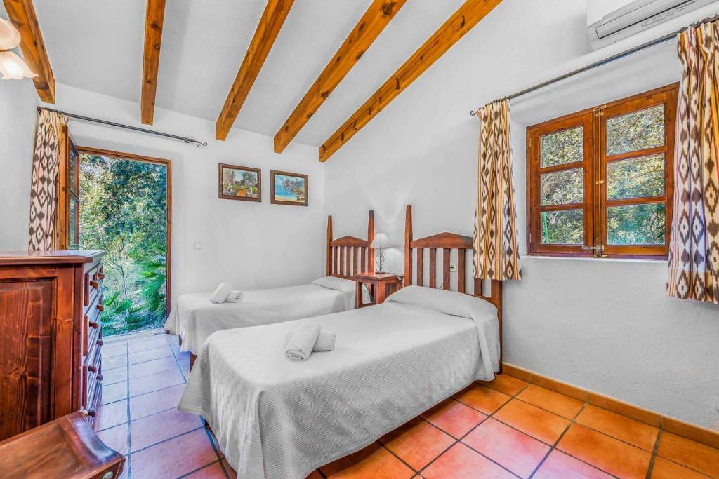 Postel nebo postele na pokoji v ubytování Cala San Vicente - 36717 Mallorca