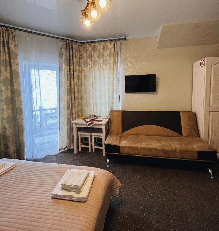 Postel nebo postele na pokoji v ubytování Viktan Hotel