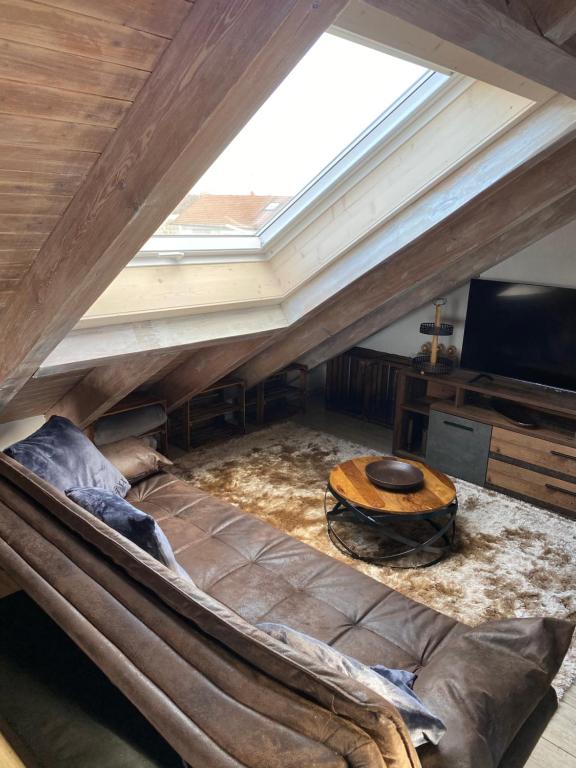 a large couch in a room with a skylight at Ferienwohnung Mayer in Langenargen