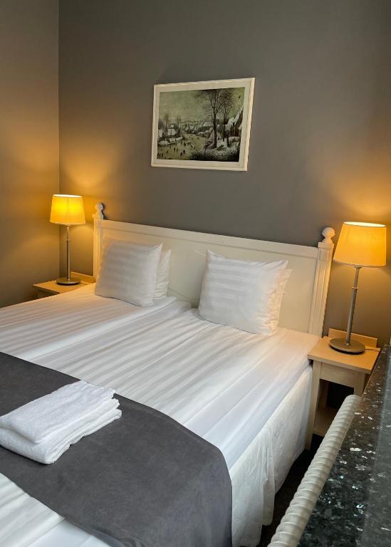 Postel nebo postele na pokoji v ubytování Unique Hotel