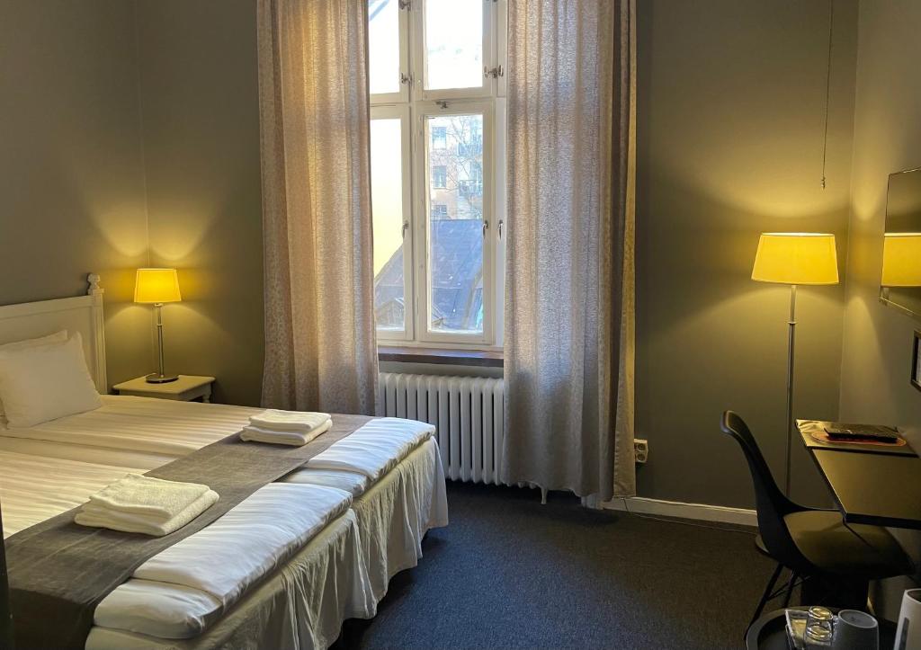 Postel nebo postele na pokoji v ubytování Unique Hotel