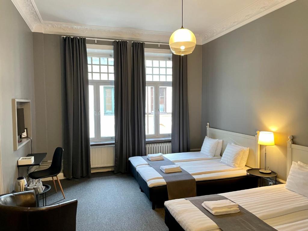 Postel nebo postele na pokoji v ubytování Unique Hotel