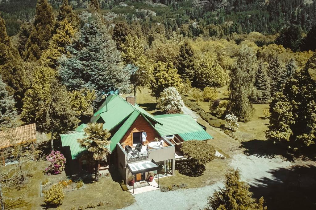 an aerial view of a house with a green roof at Linaje Hotel Boutique & Relax in Lago Puelo