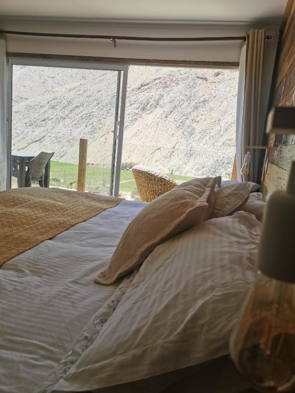 Postel nebo postele na pokoji v ubytování Lodge Nueva Elqui