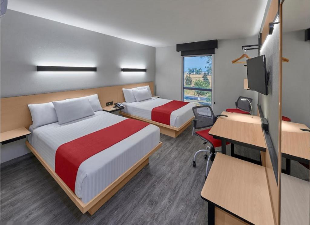 Postel nebo postele na pokoji v ubytování Hotel Best Place Express