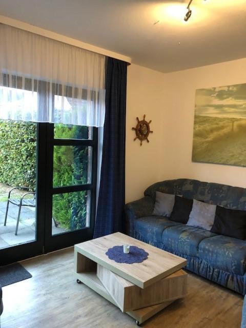 a living room with a couch and a coffee table at Haakestrasse 1j in Dahme