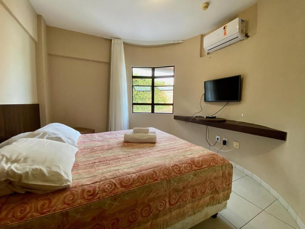 Lova arba lovos apgyvendinimo įstaigoje Elegance Hotel Natal Beira Mar