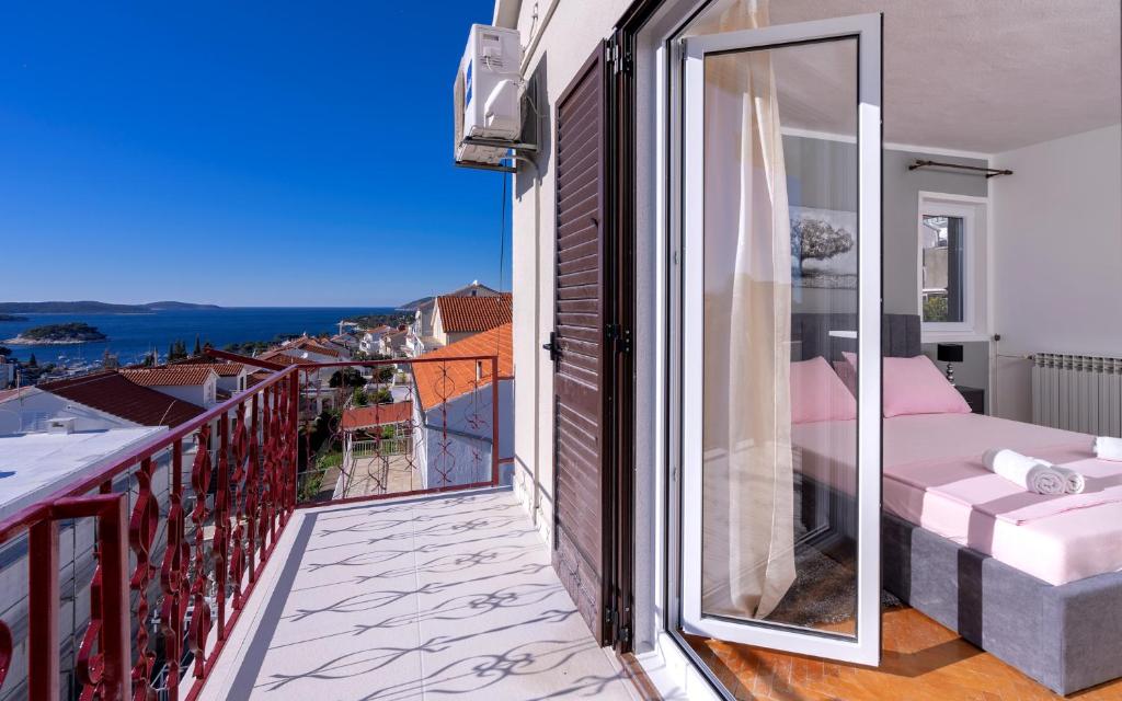 a balcony with a view of a bedroom at Villa M&M - ZF Hvar in Hvar