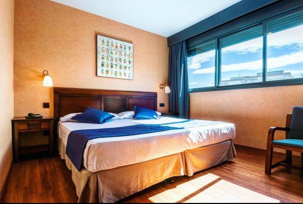 Postel nebo postele na pokoji v ubytování Hotel Las Provincias