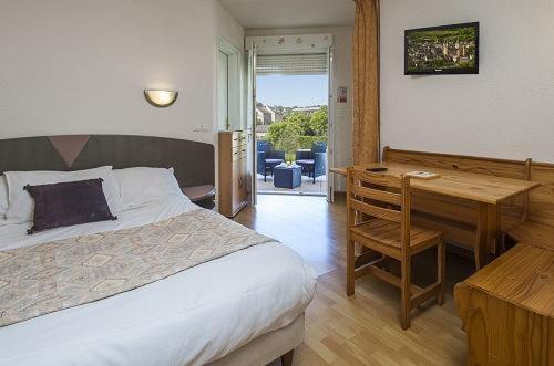 Postel nebo postele na pokoji v ubytování Hôtel Armony