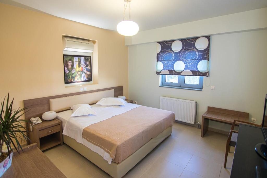 Postel nebo postele na pokoji v ubytování Thealos Village aparthotel Lefkada