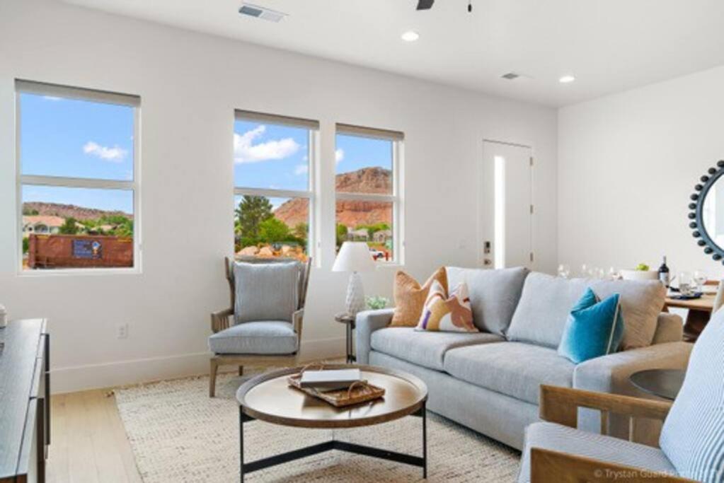 a living room with a couch and a table at Villa 25! Brand New Luxury 4 bedroom Villa! in St. George