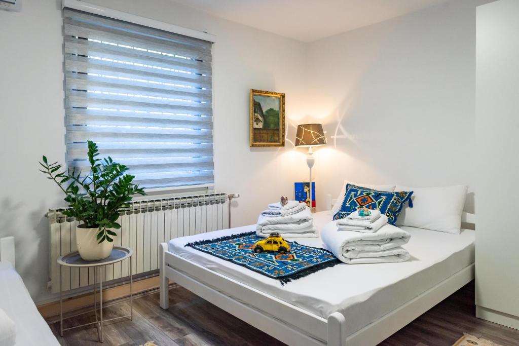 Postel nebo postele na pokoji v ubytování Hotel Vamos Sarajevo, b&b