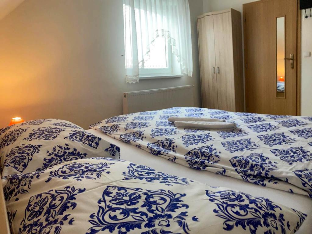A bed or beds in a room at Vila Lesana