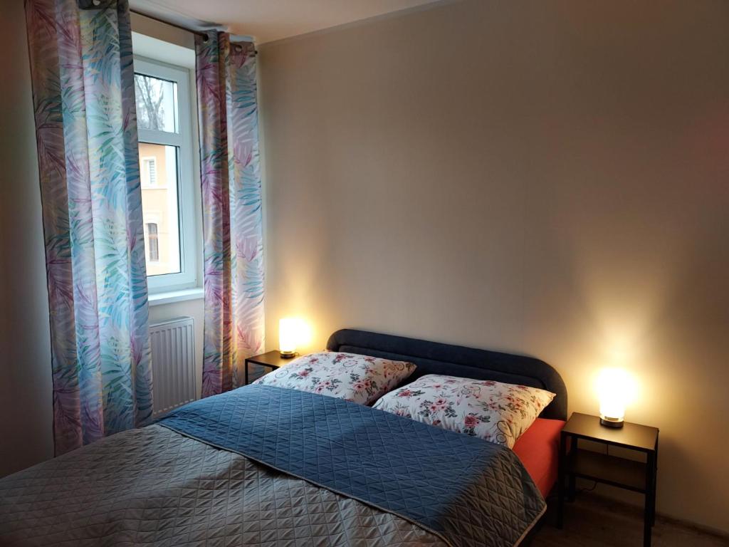 Postel nebo postele na pokoji v ubytování Apartament Karkonosze