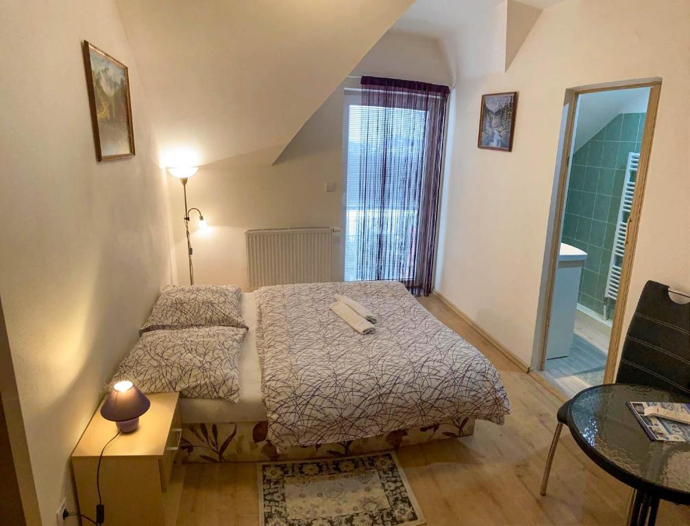 A bed or beds in a room at Vila Lesana